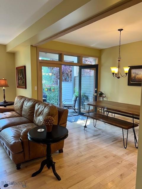 3 Gallatin Unit B, Bozeman, MT 59718 - living room featuring light wood finished floors and a chandelier