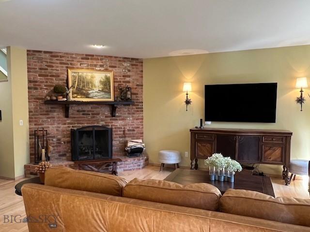 3 Gallatin Unit B, Bozeman, MT 59718 - living area with a fireplace and wood finished floors