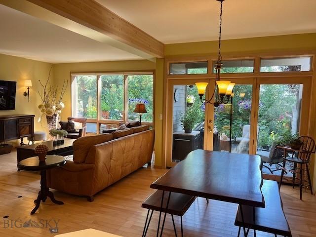 3 Gallatin Unit B, Bozeman, MT 59718 - dining space featuring light wood-style floors, a chandelier, and beamed ceiling