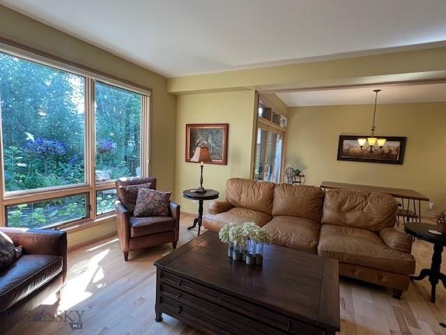 3 Gallatin Unit B, Bozeman, MT 59718 - living area featuring light wood-style flooring, healthy amount of natural light, and a chandelier