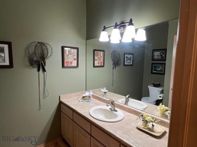 3 Gallatin Unit B, Bozeman, MT 59718 - half bathroom with vanity and a chandelier