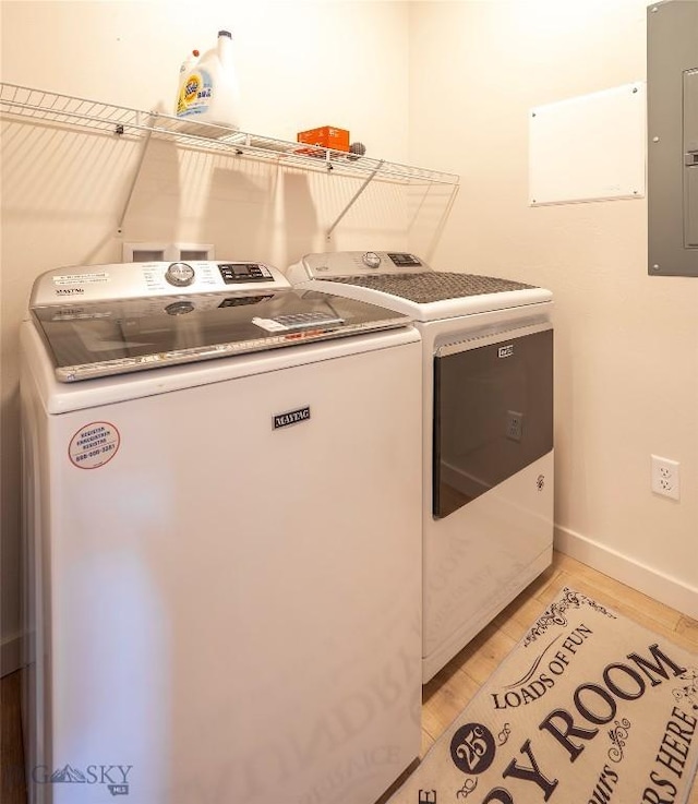 2221D Willow Dr Unit 128, Livingston, MT 59047 - laundry area with washer and dryer, electric panel, and light wood-style floors