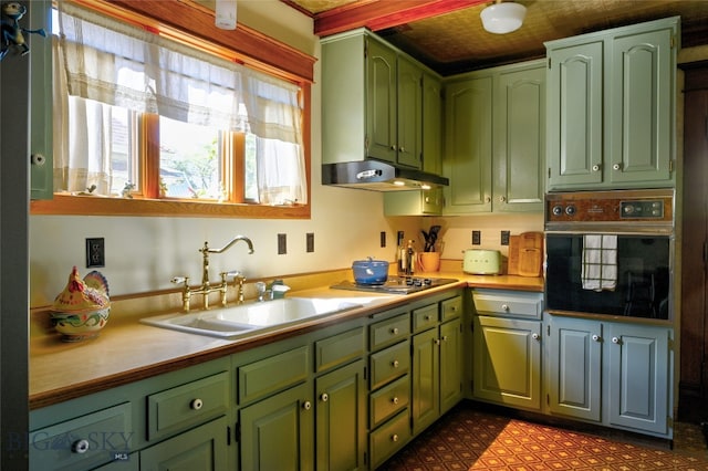 716 W Pine St, Missoula, MT 59802 - kitchen featuring black oven, green cabinets, and stovetop