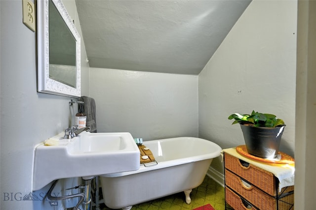 716 W Pine St, Missoula, MT 59802 - full bathroom with a freestanding bath and vaulted ceiling