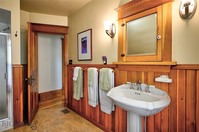 716 W Pine St, Missoula, MT 59802 - full bathroom featuring a shower stall and wainscoting