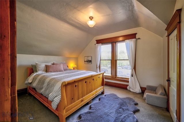 716 W Pine St, Missoula, MT 59802 - carpeted bedroom featuring lofted ceiling and baseboards