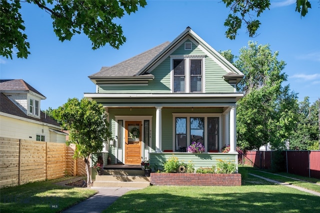716 W Pine St, Missoula, MT 59802 - victorian house featuring covered porch and roof with shingles