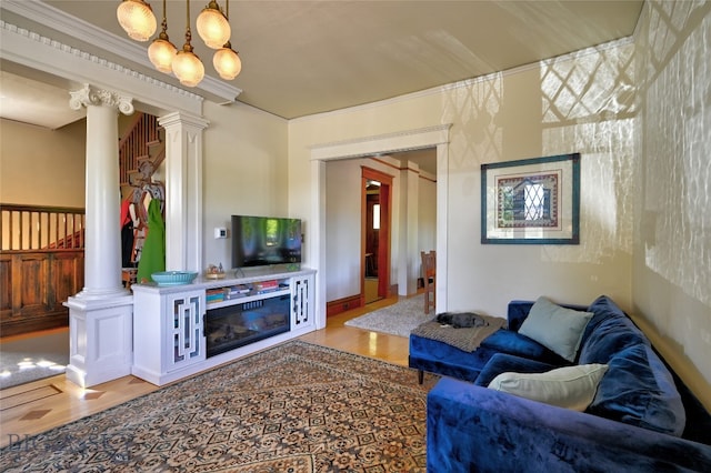 716 W Pine St, Missoula, MT 59802 - living area with ornate columns, wood finished floors, and crown molding