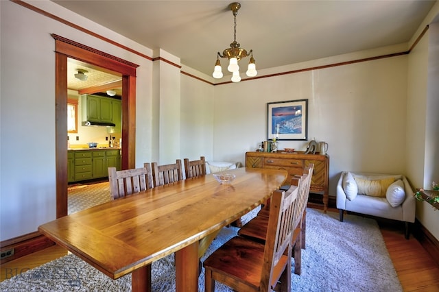 716 W Pine St, Missoula, MT 59802 - dining area with a chandelier and wood finished floors