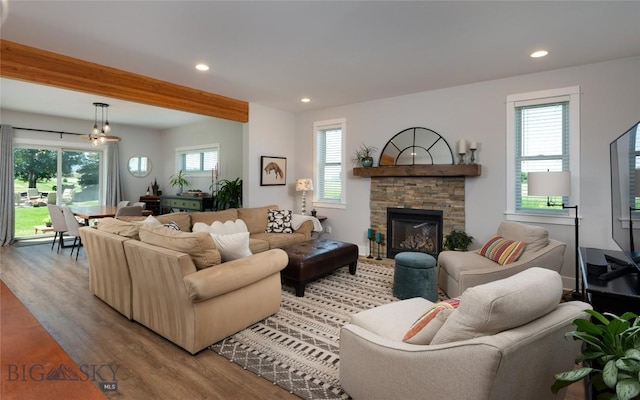 3090 Meah Ln, Bozeman, MT 59718 - living room featuring light wood finished floors, recessed lighting, a fireplace, and beam ceiling