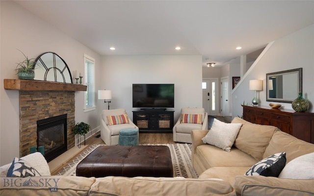 3090 Meah Ln, Bozeman, MT 59718 - living room with healthy amount of natural light, wood finished floors, recessed lighting, and a stone fireplace