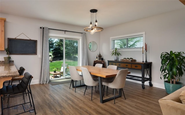 3090 Meah Ln, Bozeman, MT 59718 - dining room with dark wood-style flooring and a chandelier