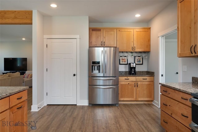 3090 Meah Ln, Bozeman, MT 59718 - kitchen featuring stainless steel fridge, dark wood finished floors, dark stone counters, recessed lighting, and open floor plan