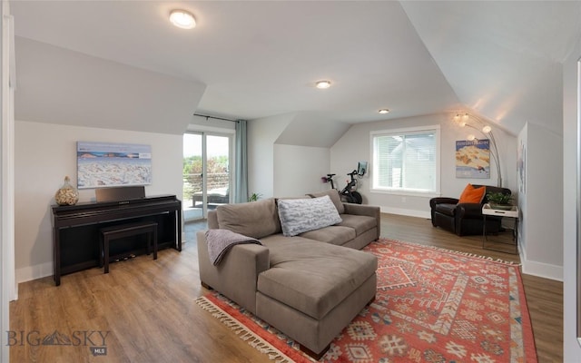 3090 Meah Ln, Bozeman, MT 59718 - living room featuring vaulted ceiling, healthy amount of natural light, and light wood-style floors