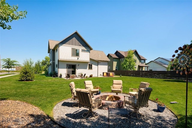 3090 Meah Ln, Bozeman, MT 59718 - rear view of property with board and batten siding and a fire pit