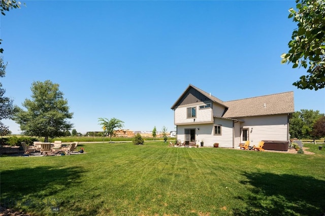 3090 Meah Ln, Bozeman, MT 59718 - back of property with a lawn and a fire pit