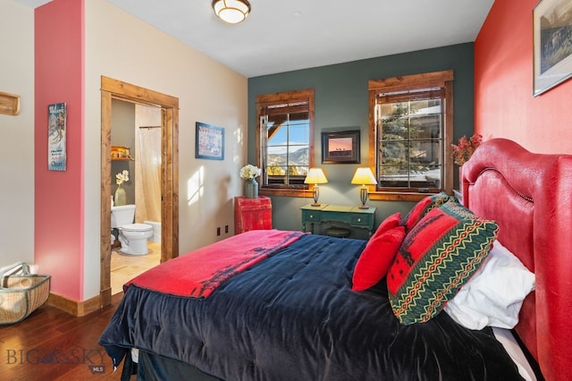 58 Upper Moose Hill Rd, Big Sky, MT 59716 - bedroom featuring wood finished floors and connected bathroom