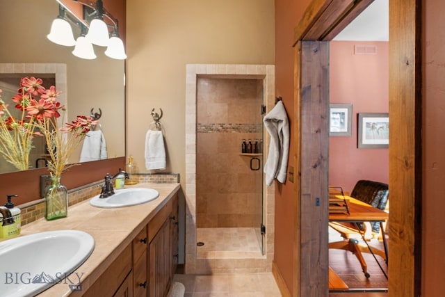 58 Upper Moose Hill Rd, Big Sky, MT 59716 - full bath with double vanity, a chandelier, a tile shower, and tile patterned floors
