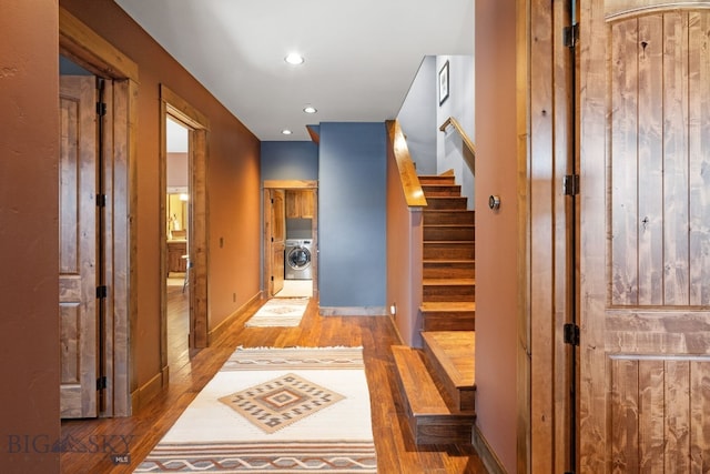 58 Upper Moose Hill Rd, Big Sky, MT 59716 - hallway with washer / dryer, wood finished floors, recessed lighting, and stairs