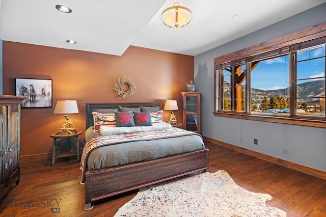 58 Upper Moose Hill Rd, Big Sky, MT 59716 - bedroom featuring wood finished floors, a mountain view, and recessed lighting