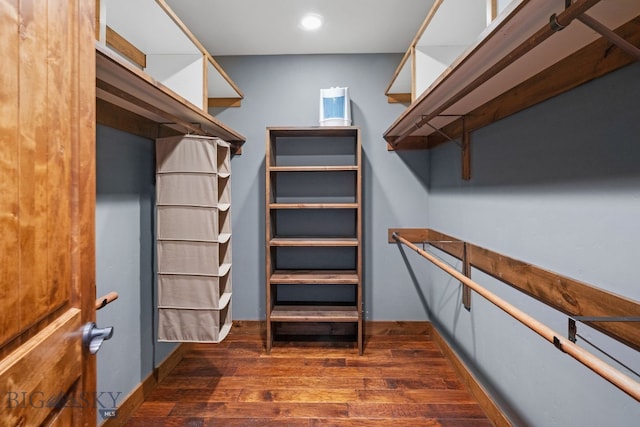58 Upper Moose Hill Rd, Big Sky, MT 59716 - walk in closet featuring dark wood finished floors