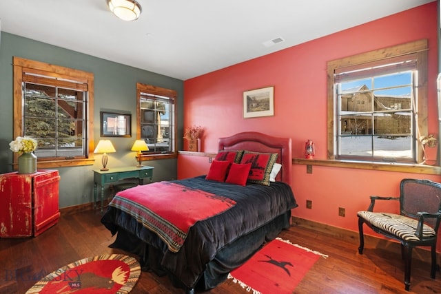 58 Upper Moose Hill Rd, Big Sky, MT 59716 - bedroom featuring multiple windows and hardwood / wood-style flooring