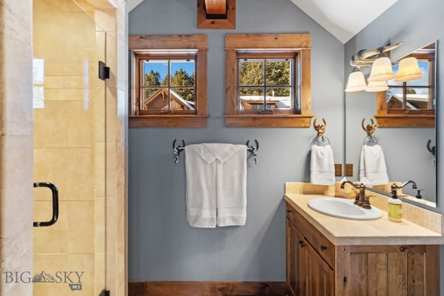 58 Upper Moose Hill Rd, Big Sky, MT 59716 - full bath with vanity, a shower stall, and vaulted ceiling