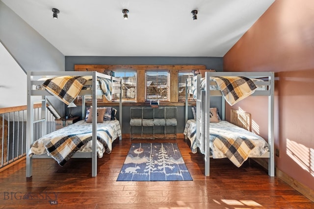 58 Upper Moose Hill Rd, Big Sky, MT 59716 - bedroom with hardwood / wood-style flooring and lofted ceiling
