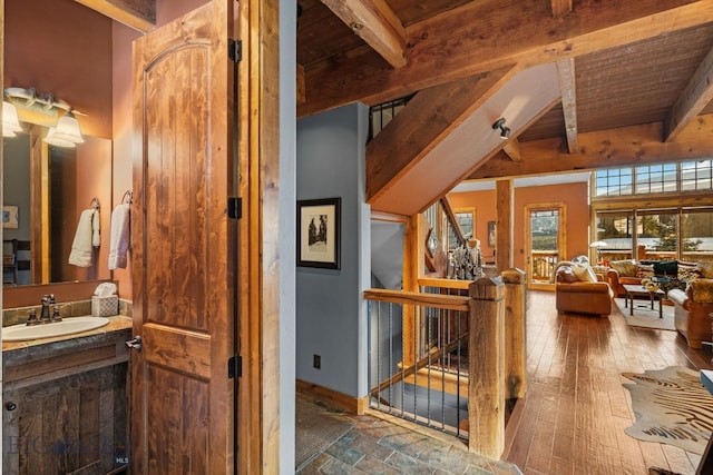 58 Upper Moose Hill Rd, Big Sky, MT 59716 - corridor with an upstairs landing and a wooden ceiling with exposed beams