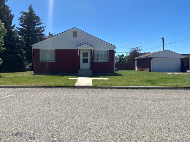 1120 A St, Butte, MT 59701 - view of front of home with a detached garage, a front lawn, an outbuilding, and entry steps
