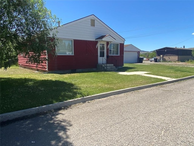 1120 A St, Butte, MT 59701 - bungalow with a detached garage, crawl space, and a front lawn