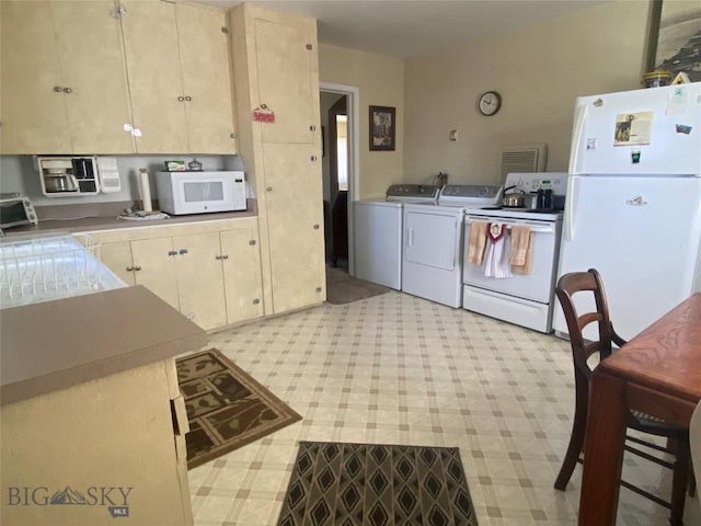 1120 A St, Butte, MT 59701 - kitchen with white appliances and washing machine and dryer
