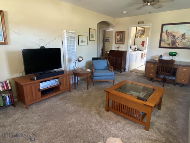 1120 A St, Butte, MT 59701 - carpeted living room with arched walkways and ceiling fan