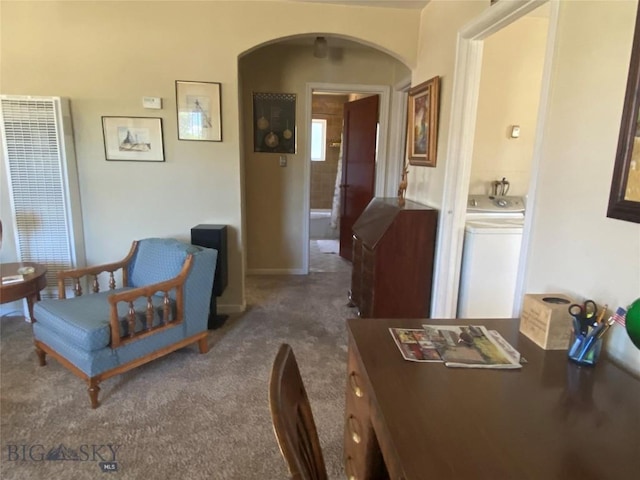 1120 A St, Butte, MT 59701 - carpeted living area with arched walkways, a heating unit, and washer / dryer