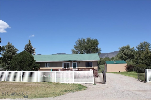 19970 Mt Highway 91 N, Glen, MT 59732 - view of front facade with a fenced front yard and a metal roof
