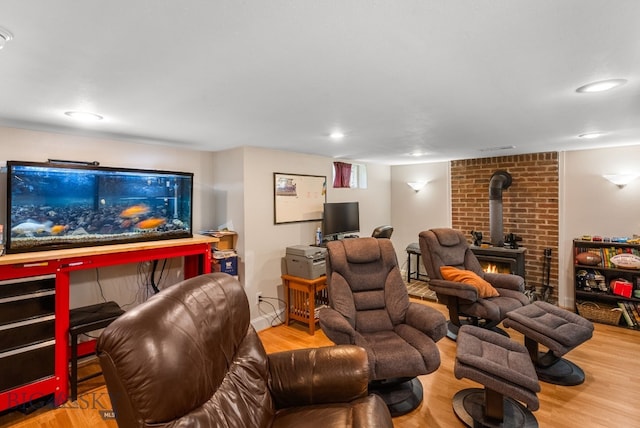 531 N Main St, Livingston, MT 59047 - living room featuring wood finished floors, a wood stove, and recessed lighting