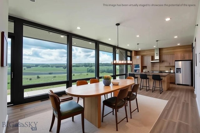 28 Elk Meadows Ranch Rd, Cameron, MT 59720 - dining room with light wood-style flooring, recessed lighting, and expansive windows