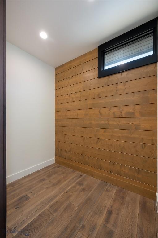 28 Elk Meadows Ranch Rd, Cameron, MT 59720 - finished basement featuring dark wood finished floors, wooden walls, and recessed lighting