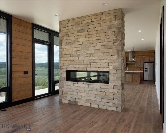 28 Elk Meadows Ranch Rd, Cameron, MT 59720 - unfurnished living room featuring wood finished floors and recessed lighting