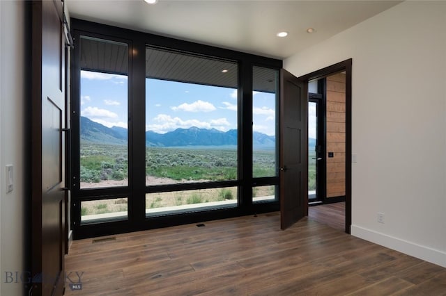 28 Elk Meadows Ranch Rd, Cameron, MT 59720 - unfurnished room featuring a mountain view, dark wood-style flooring, and recessed lighting