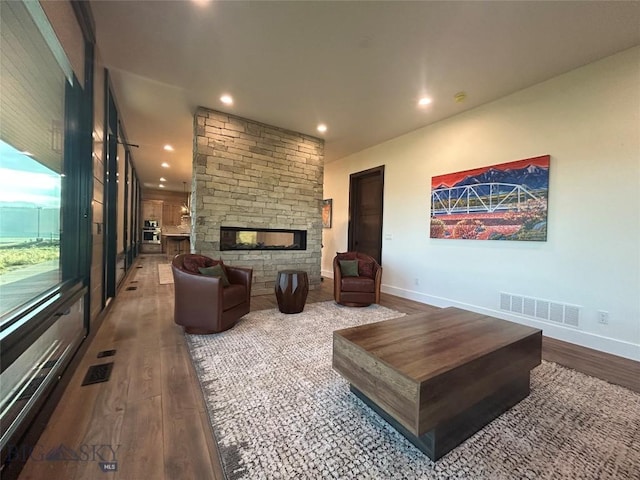28 Elk Meadows Ranch Rd, Cameron, MT 59720 - living area featuring wood finished floors, recessed lighting, and a stone fireplace