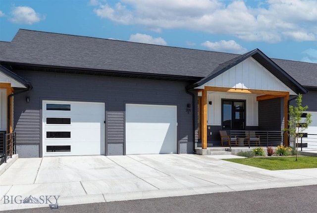 205 Albrey Trl Unit B, Bozeman, MT 59718 - modern farmhouse featuring a garage, roof with shingles, a porch, and concrete driveway