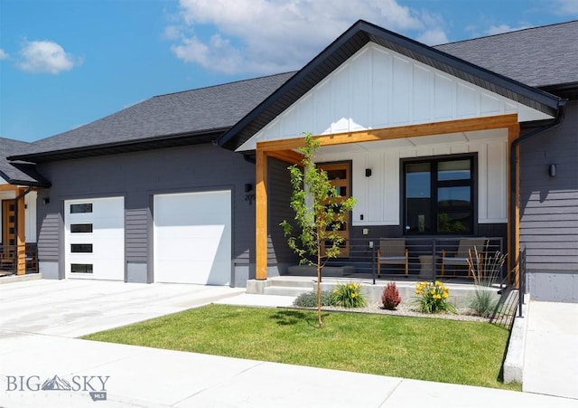 205 Albrey Trl Unit B, Bozeman, MT 59718 - view of front of house featuring board and batten siding, a porch, a garage, and a shingled roof