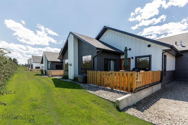 205 Albrey Trl Unit B, Bozeman, MT 59718 - back of property with board and batten siding and a lawn