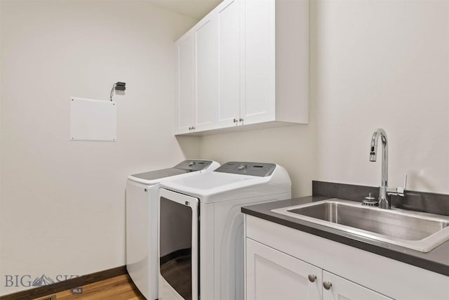205 Albrey Trl Unit B, Bozeman, MT 59718 - washroom featuring washer and dryer, cabinet space, and wood finished floors