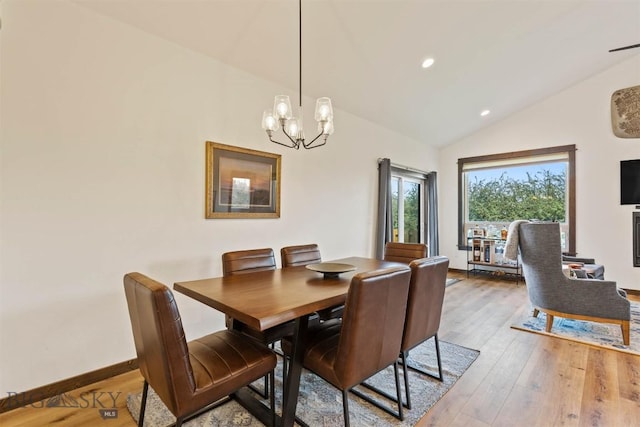 205 Albrey Trl Unit B, Bozeman, MT 59718 - dining area featuring vaulted ceiling, a chandelier, wood finished floors, and recessed lighting
