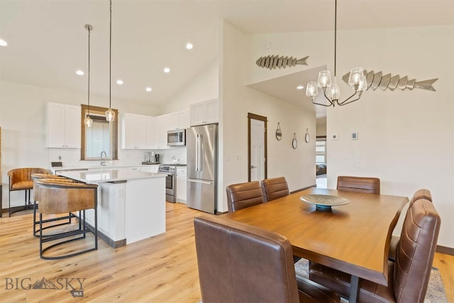 205 Albrey Trl Unit B, Bozeman, MT 59718 - dining room with light wood-style flooring, a chandelier, recessed lighting, and high vaulted ceiling