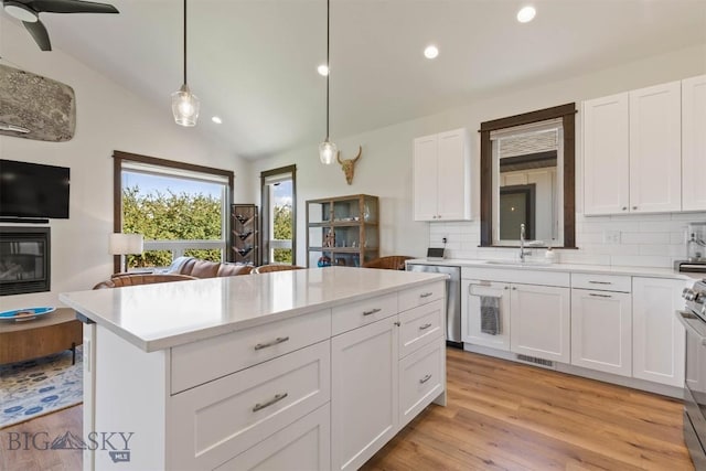 205 Albrey Trl Unit B, Bozeman, MT 59718 - kitchen with stainless steel appliances, tasteful backsplash, open floor plan, light countertops, and recessed lighting