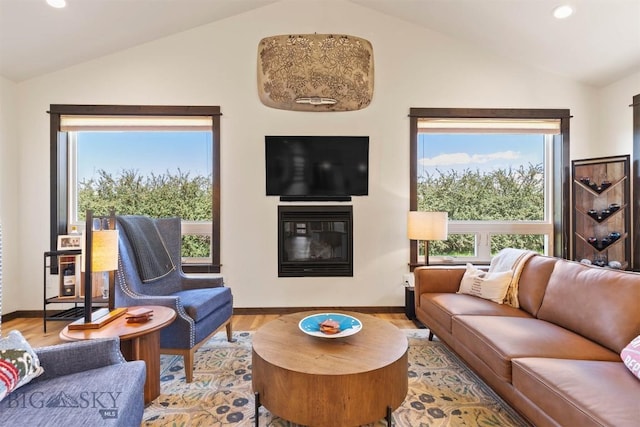 205 Albrey Trl Unit B, Bozeman, MT 59718 - living room featuring lofted ceiling, a glass covered fireplace, wood finished floors, and recessed lighting