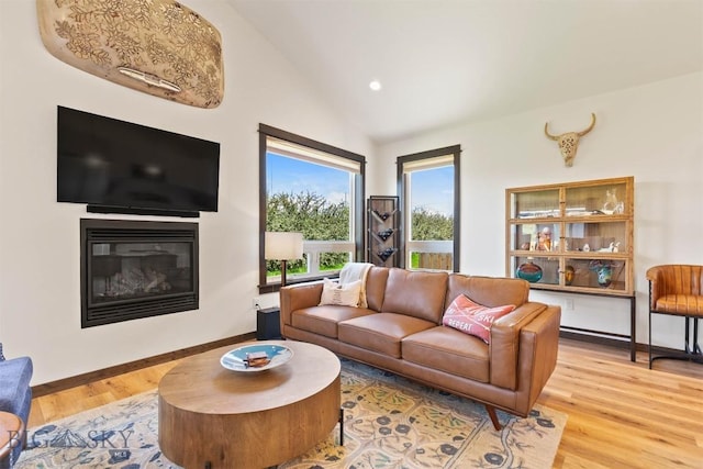 205 Albrey Trl Unit B, Bozeman, MT 59718 - living area with light wood-type flooring, a glass covered fireplace, lofted ceiling, and recessed lighting